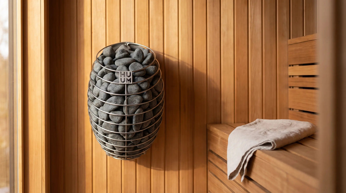 HUUM DROP electric sauna heater wall mounted in a cedar sauna