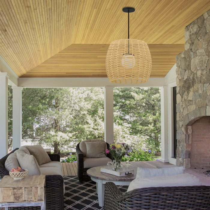 Modern black outdoor pendant light installed over a patio dining area — exterior LED outdoor pendant light with adjustable color temperature