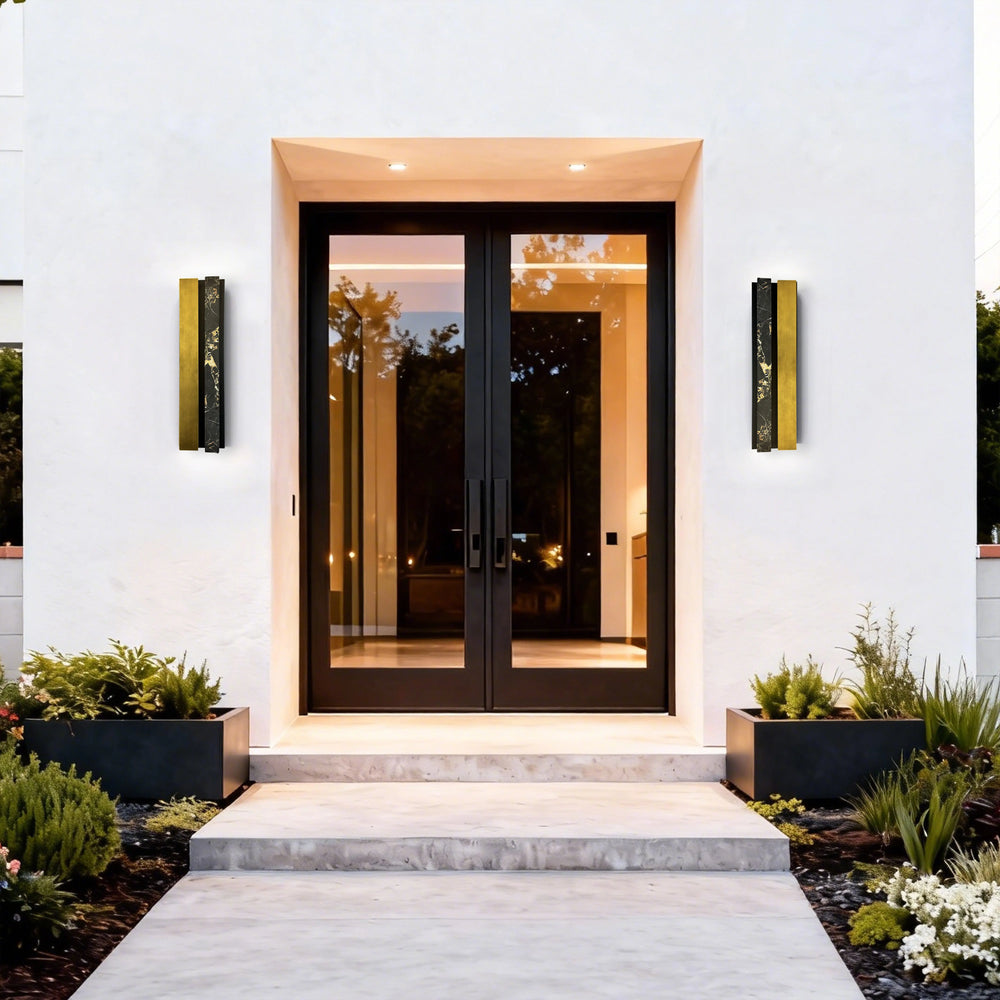 IP65 LED outdoor wall sconce in antique brass finish on home exterior
