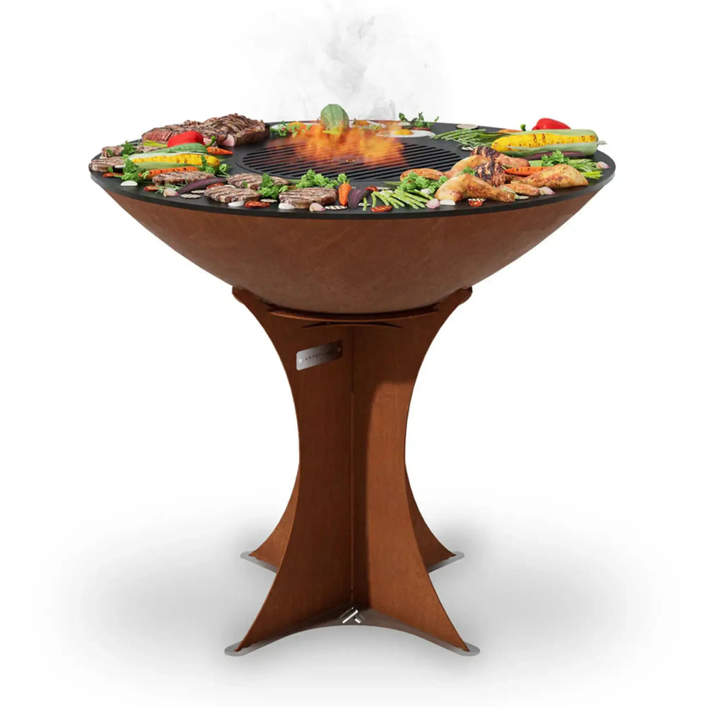 Arteflame Euro 40 grill with food cooking on the circular carbon steel cooktop — premium wood-fired Arteflame grill for outdoor cooking