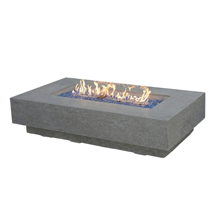 Large outdoor fire pit table in lifestyle setting — premium patio fire pit table anchoring a sectional seating arrangement