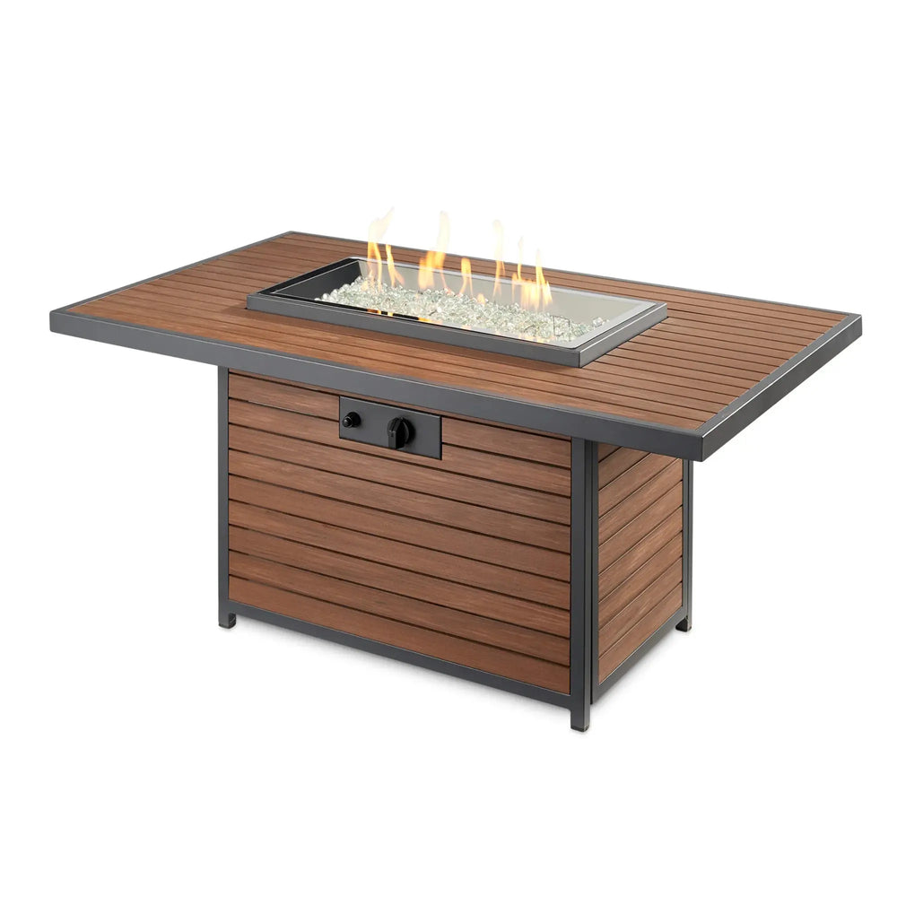 The Outdoor GreatRoom Company linear fire pit with vibrant golden flame — premium rectangular gas fire pit with Crystal Fire Plus burner technology