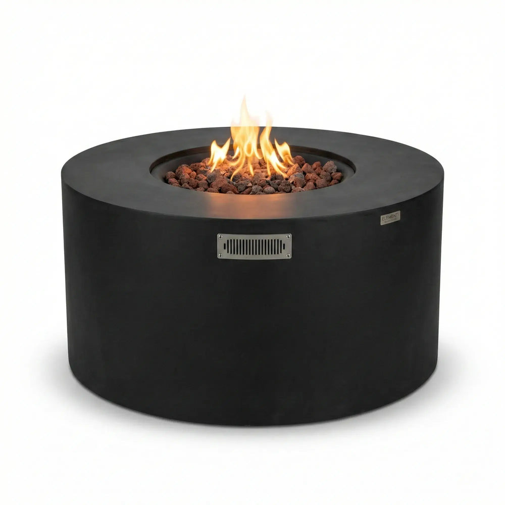 Propane round fire pit with flames in an outdoor patio setting