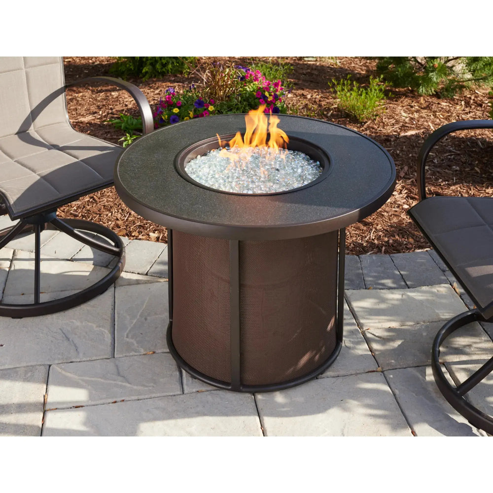 Compact round 32-inch propane fire pit table with hidden tank storage — small gas fire pit table for balconies and intimate patios